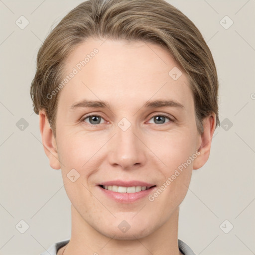 Joyful white young-adult female with short  brown hair and grey eyes