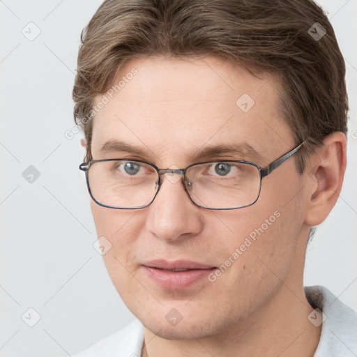 Joyful white adult male with short  brown hair and grey eyes