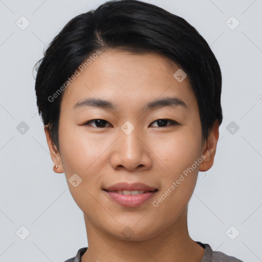 Joyful asian young-adult female with short  black hair and brown eyes