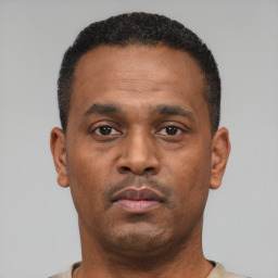 Neutral black young-adult male with short  black hair and brown eyes