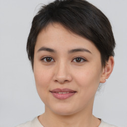 Joyful asian young-adult female with medium  brown hair and brown eyes