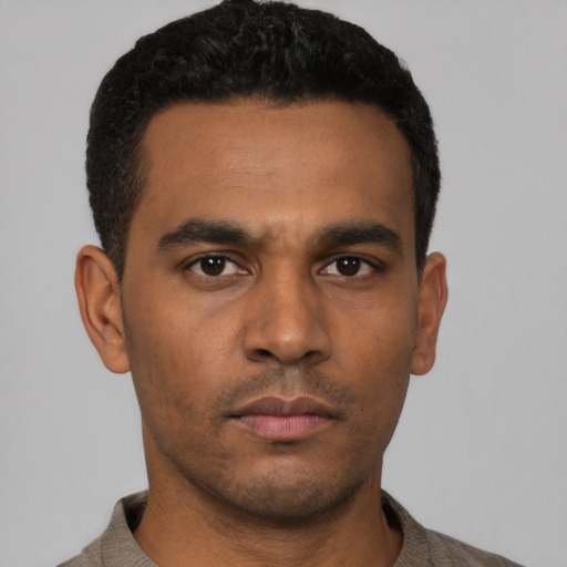 Neutral latino young-adult male with short  black hair and brown eyes