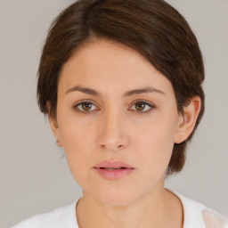 Neutral white young-adult female with medium  brown hair and brown eyes