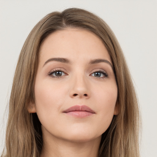 Neutral white young-adult female with long  brown hair and brown eyes