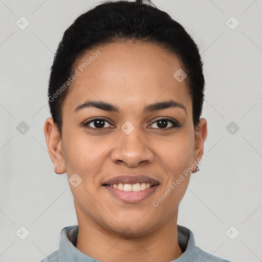 Joyful latino young-adult female with short  brown hair and brown eyes