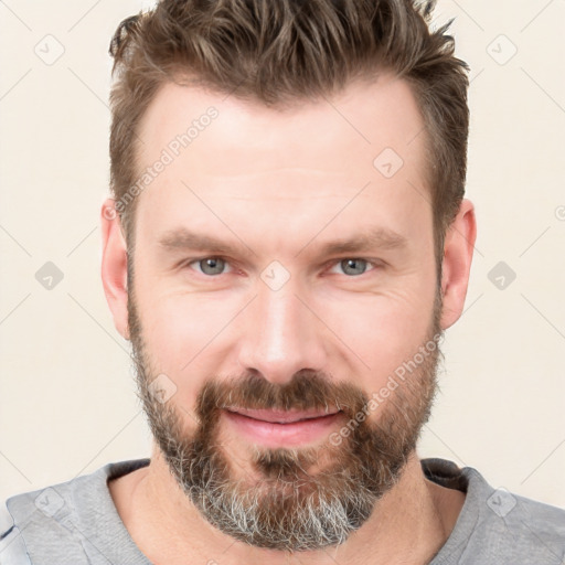 Joyful white adult male with short  brown hair and grey eyes