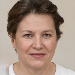 Joyful white adult female with short  brown hair and brown eyes