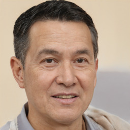 Joyful white middle-aged male with short  brown hair and brown eyes