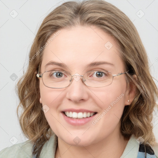 Joyful white young-adult female with medium  brown hair and blue eyes