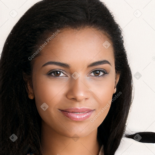 Joyful black young-adult female with long  brown hair and brown eyes