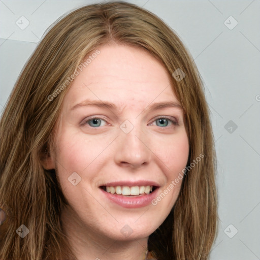 Joyful white young-adult female with long  brown hair and green eyes