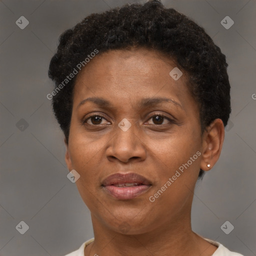 Joyful black adult female with short  brown hair and brown eyes