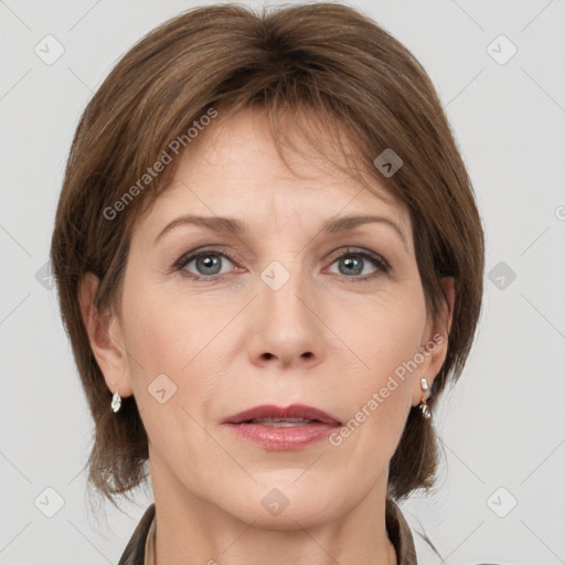 Joyful white adult female with medium  brown hair and grey eyes