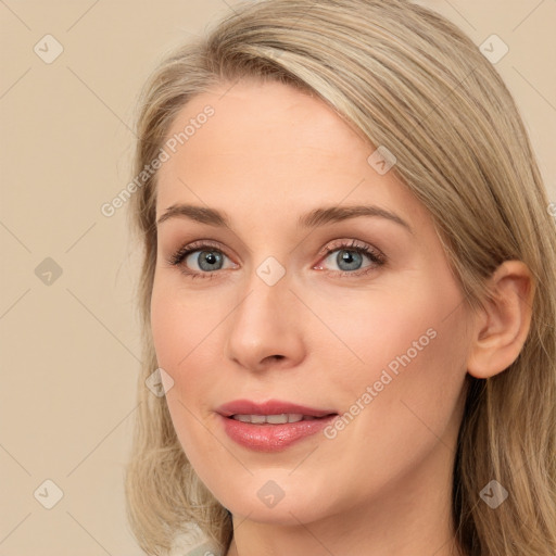 Joyful white young-adult female with long  brown hair and blue eyes