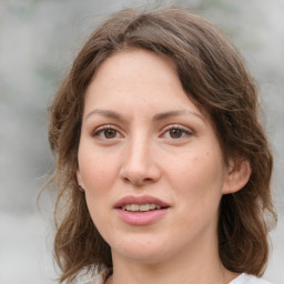 Joyful white young-adult female with medium  brown hair and green eyes