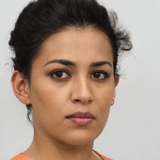 Neutral latino young-adult female with short  brown hair and brown eyes