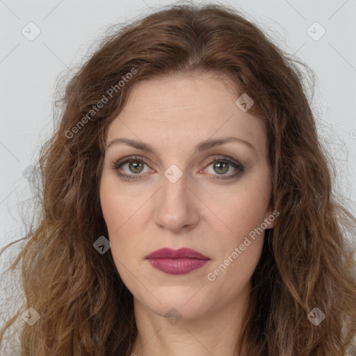 Joyful white young-adult female with long  brown hair and green eyes