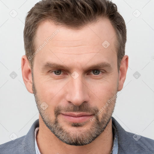 Joyful white adult male with short  brown hair and grey eyes