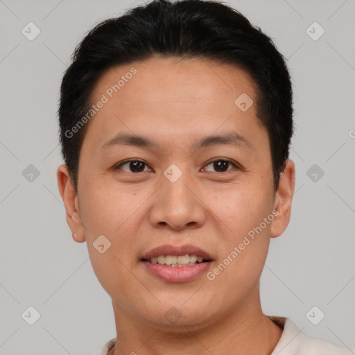 Joyful asian young-adult male with short  brown hair and brown eyes