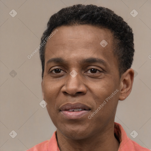 Joyful latino adult male with short  black hair and brown eyes