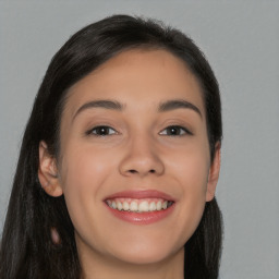 Joyful white young-adult female with long  black hair and brown eyes