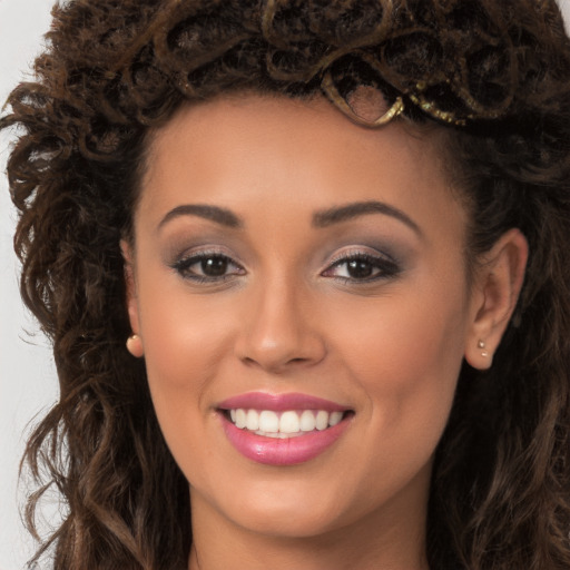 Joyful white young-adult female with long  brown hair and brown eyes