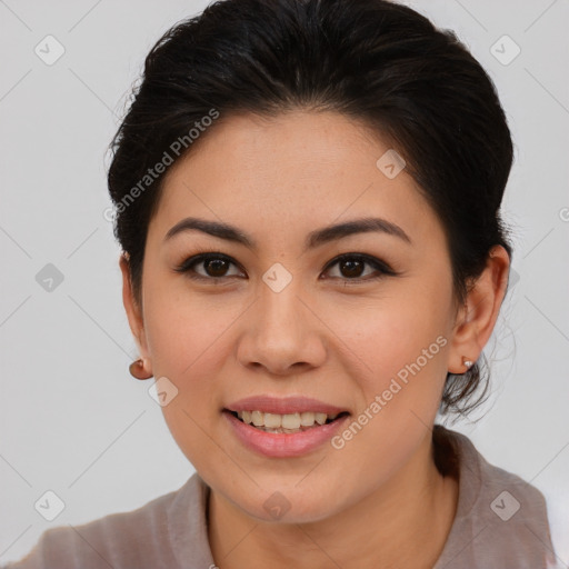 Joyful asian young-adult female with medium  brown hair and brown eyes