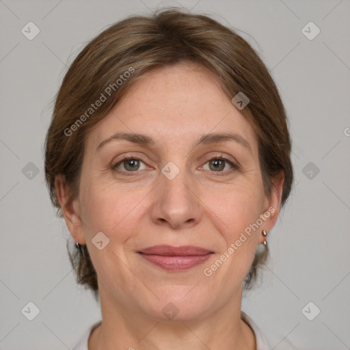 Joyful white adult female with medium  brown hair and grey eyes