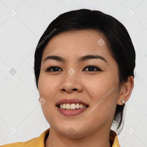 Joyful asian young-adult female with medium  black hair and brown eyes