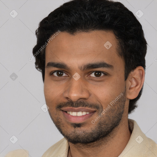 Joyful latino young-adult male with short  black hair and brown eyes