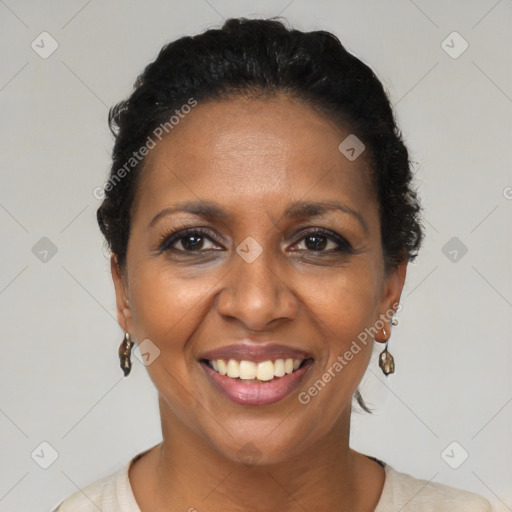 Joyful black adult female with short  brown hair and brown eyes