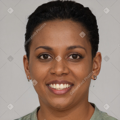 Joyful black young-adult female with short  brown hair and brown eyes