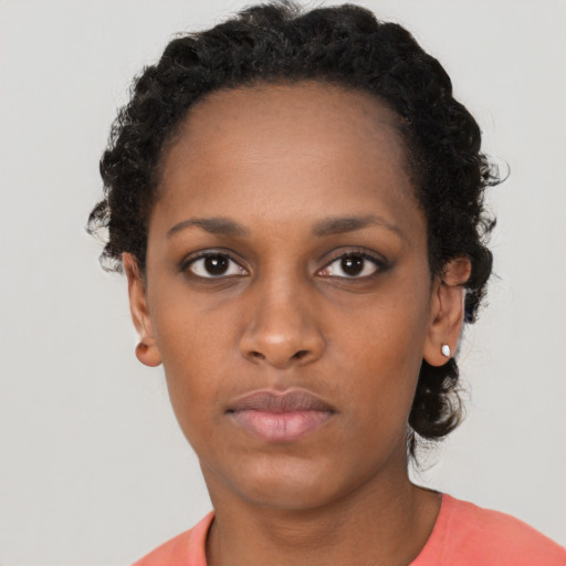 Neutral black young-adult female with short  black hair and brown eyes