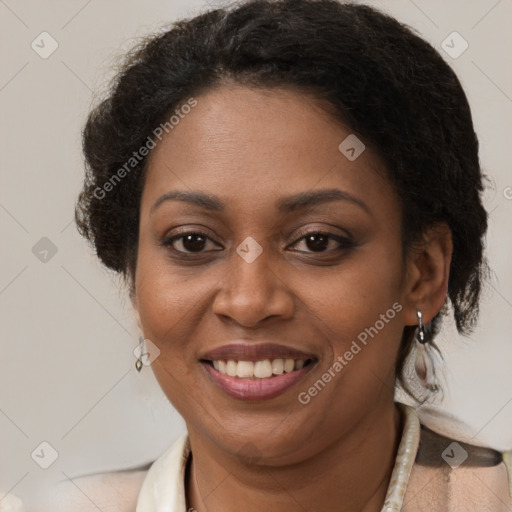 Joyful black adult female with short  brown hair and brown eyes