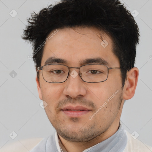 Joyful white young-adult male with short  black hair and brown eyes