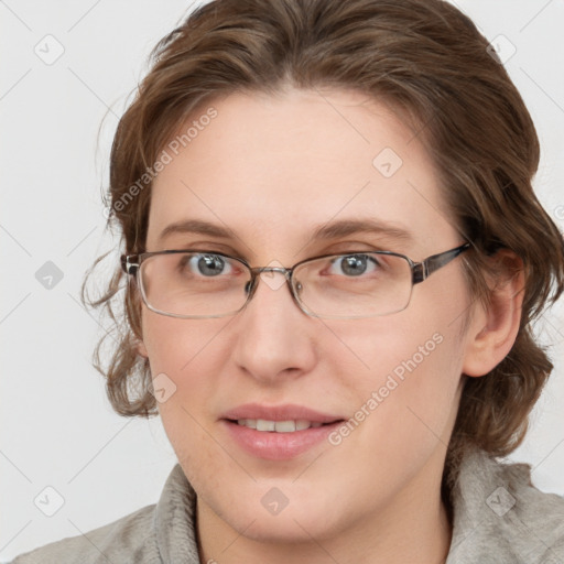 Joyful white young-adult female with medium  brown hair and blue eyes