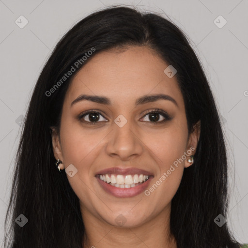 Joyful latino young-adult female with long  brown hair and brown eyes