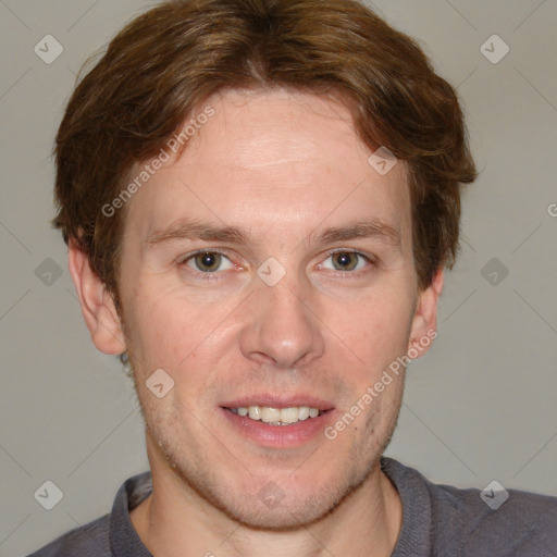 Joyful white adult male with short  brown hair and grey eyes