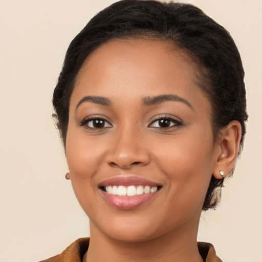 Joyful latino young-adult female with long  brown hair and brown eyes