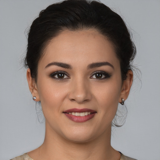 Joyful white young-adult female with medium  brown hair and brown eyes
