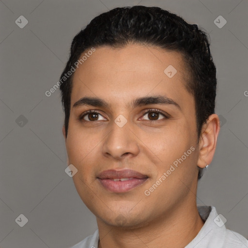 Joyful latino young-adult male with short  black hair and brown eyes