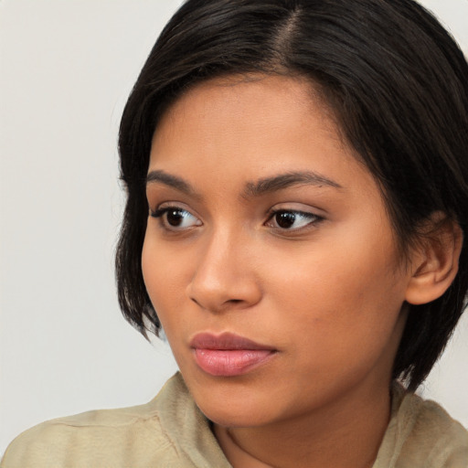 Neutral latino young-adult female with medium  brown hair and brown eyes