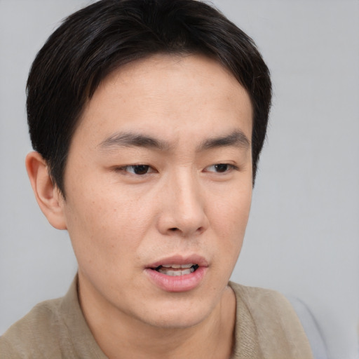 Neutral asian young-adult male with short  brown hair and brown eyes