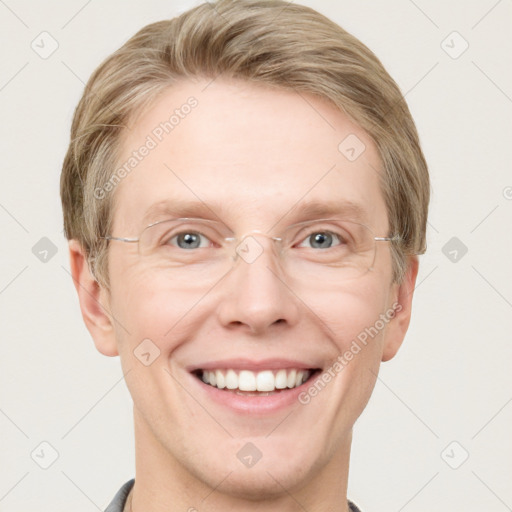 Joyful white adult male with short  brown hair and grey eyes