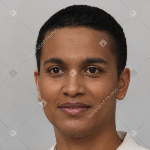 Joyful black young-adult male with short  black hair and brown eyes