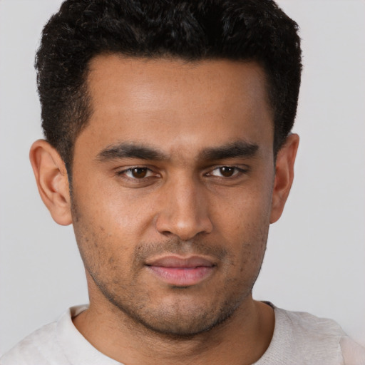 Neutral white young-adult male with short  black hair and brown eyes