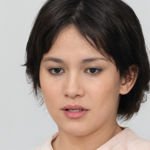 Neutral asian young-adult female with medium  brown hair and brown eyes