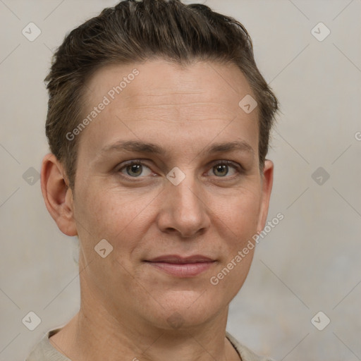 Joyful white adult female with short  brown hair and grey eyes