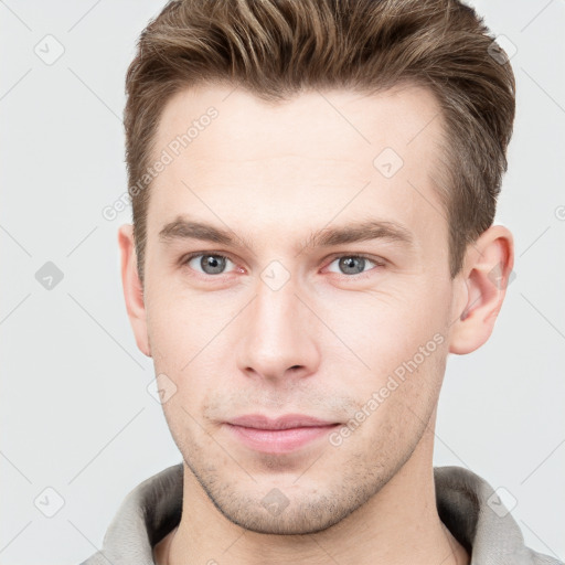 Neutral white young-adult male with short  brown hair and grey eyes