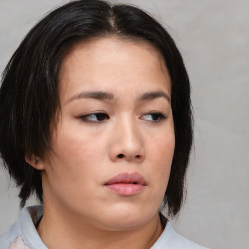 Neutral asian young-adult female with medium  brown hair and brown eyes